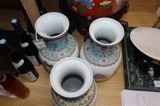 A pair of Chinese famille rose vases and another similar (3) Height 36cm